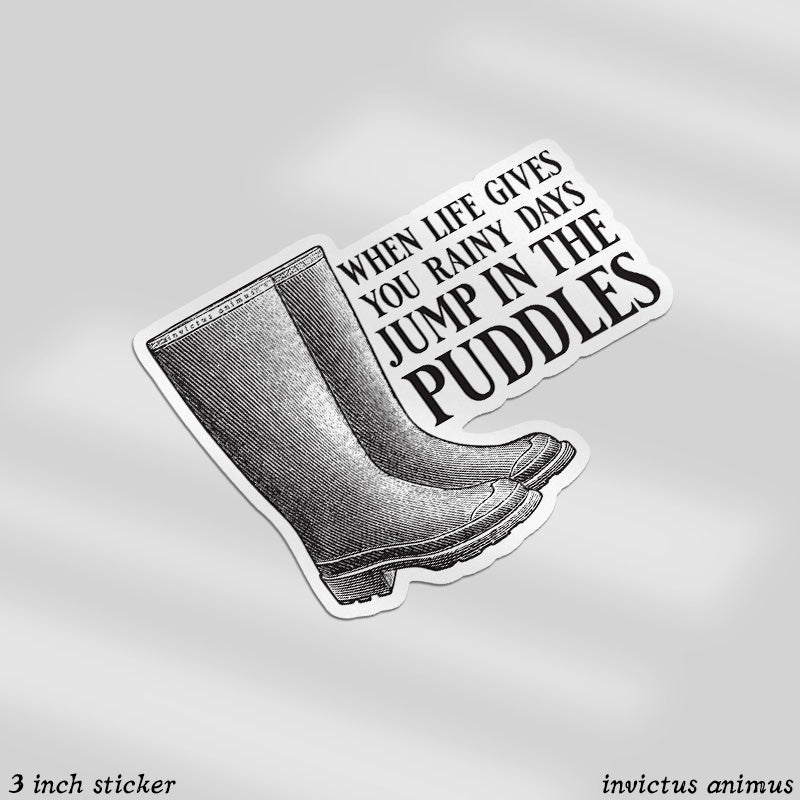 A pair of rainboots with "When life gives you rainy days, Jump in the puddles" in all cap sarif font
